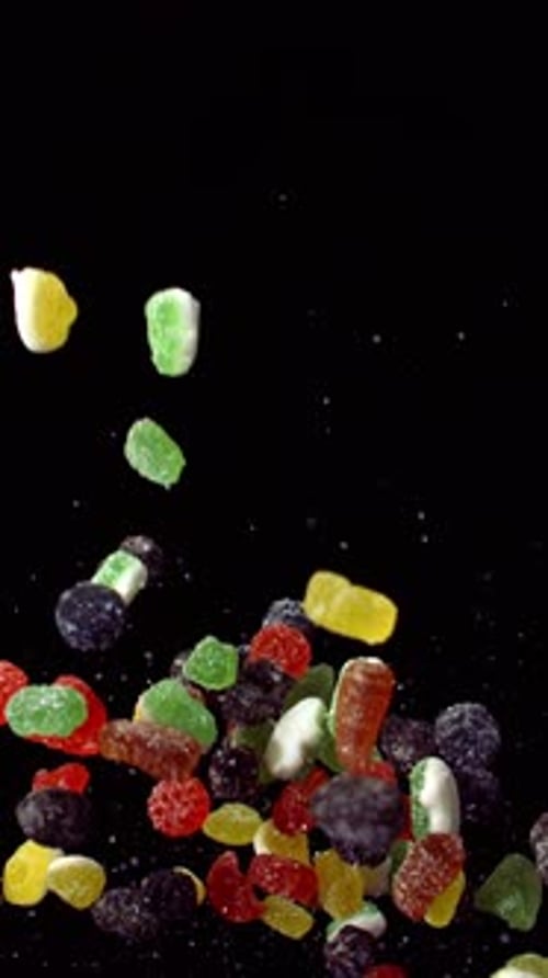Colorful Gummy Candies Falling in Slow Motion