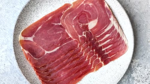 Meat, ham, jamon, or prosciutto sliced for breakfast bruschetta. Sliced ham, jamon, or prosciutto