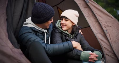 Affectionate Couple Smiling in Camping Tent