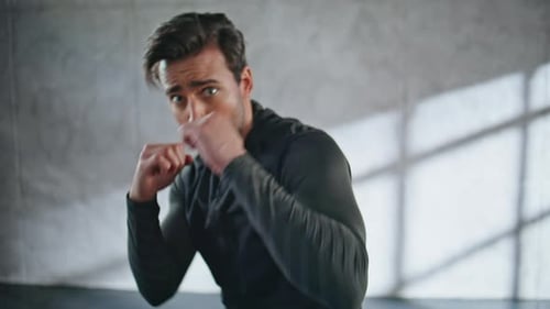 Guy Boxer Punching Air in Loft Gym Closeup Active Sportsman Cardio Exercising