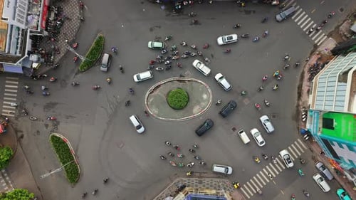 Aerial Topdown View of Busy Roundabout Traffic in Ho Chi Minh City Vietnam