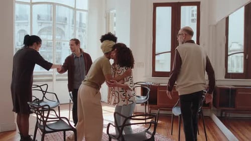 Adults Gather in Circle for Meeting or Therapy