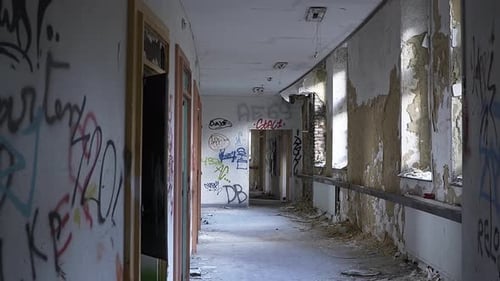 hallway of an abandoned hospital-asylum. moving straight through the hallways.