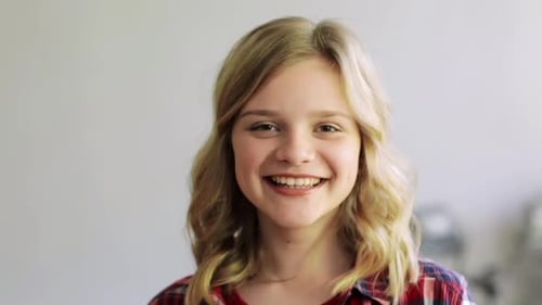 Smiling teen girl portrait in a casual setting