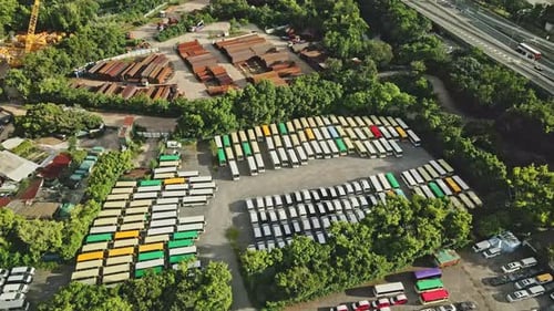 Minibuses parked at depot during COVID-19 pandemic, Hong Kong; drone