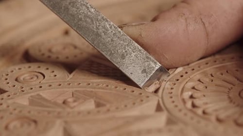 Hand Carving Ornate Wooden Design with Chisel