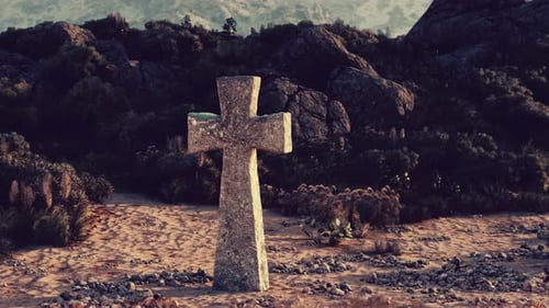 A Solitary Cross Standing in the Vastness of a Desert Landscape