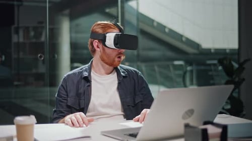 Futuristic Workflow Man Uses 3D Augmented Reality Glasses in Modern Office