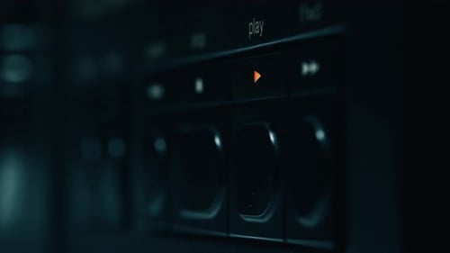 Finger Presses Play Button on Technology