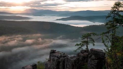 Majestic Fog Enveloping Picturesque Mountain Scenery