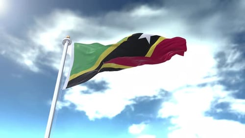 Waving Flag of Saint Kitts and Nevis in Blue Sky