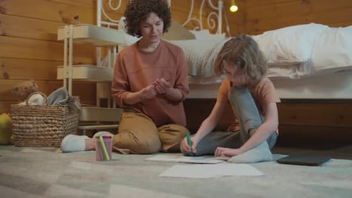 Mother and Child Drawing Together at Home