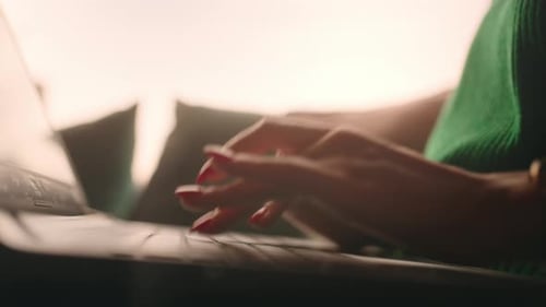 Close Up of Hands Typing on Laptop Keyboard