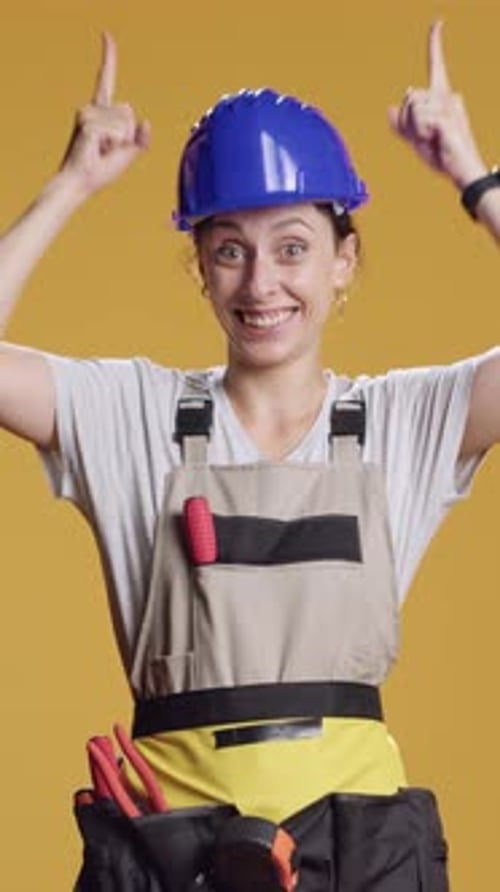 Vertical Video Powerful Handywoman Pointing Up to Advertise Upwards Direction