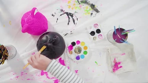 Child Painting Colorful Decorative Animals at Home