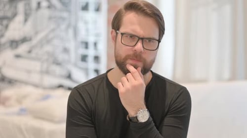Portrait of Brainstorming Young Adult Man with New Idea
