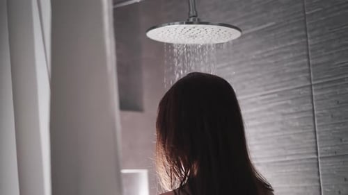 Woman Showering with Round Showerhead
