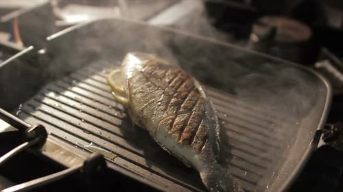 Macro Fish Frys on Pan in Steam Clouds on Stove