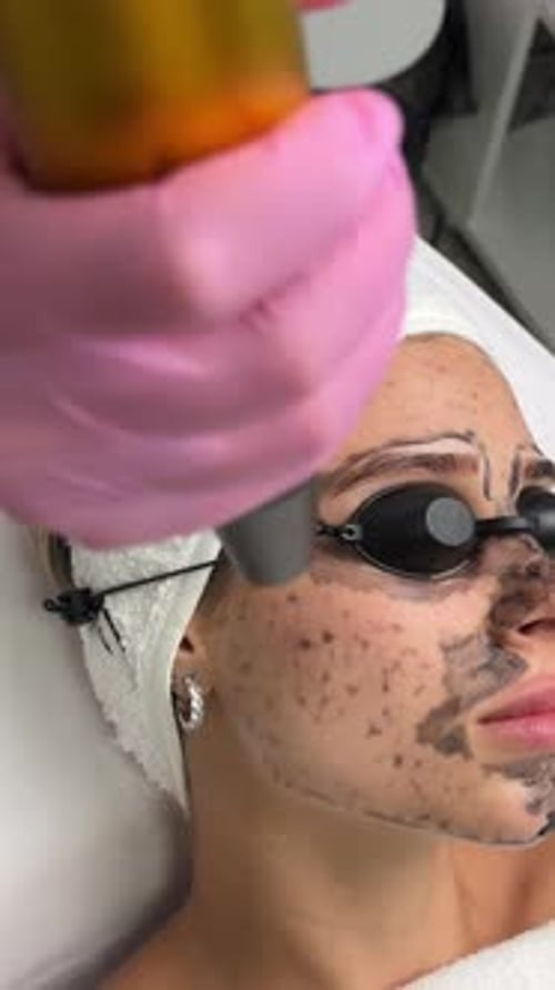 Woman Receives Cosmetic Facial Treatment