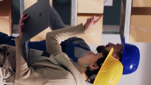 Vertical Video Diverse Employees Talking About Stock Logistics in Depot