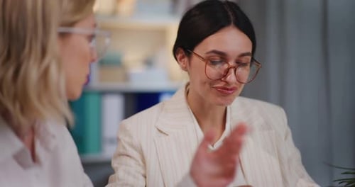 Business Women Working Together at Office