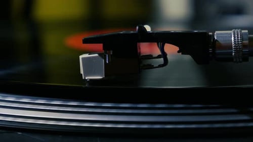 Black Vinyl Record Spinning on Turntable Close Up