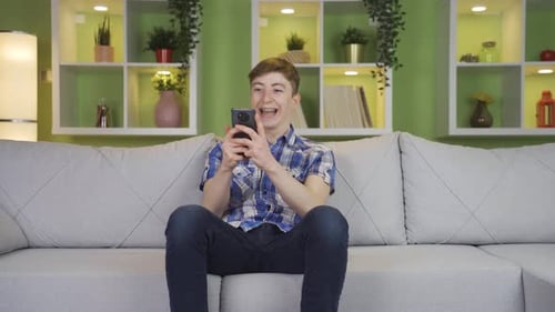 Teen Watches Phone and Celebrates Good News