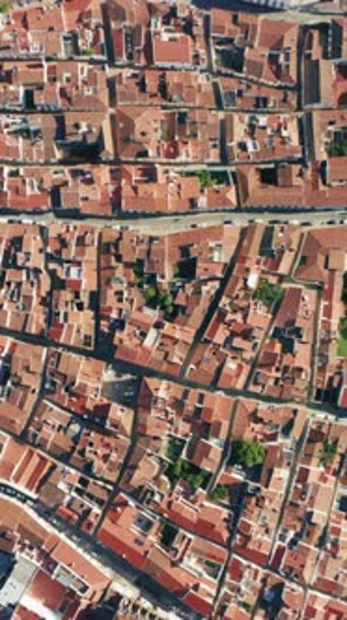 Aerial Video of a Mediterranean Town with Red Roofs Narrow Streets and Unique Architecture