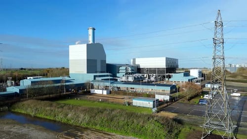 Cinematic aerial of the King’s Lynn power station at winter sunset, emphasizing energy production