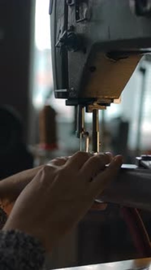 Vertical of Seamstress Working on Sewing Machine Stitching Textile Atelier Repairing and Tailoring