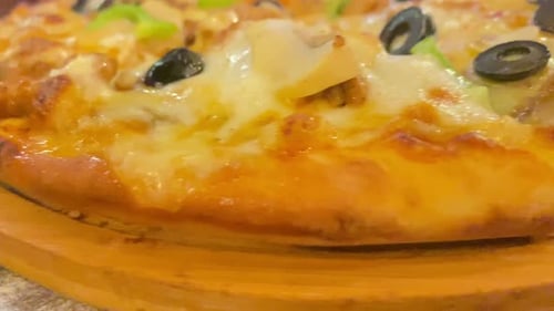Close Up of Delicious Pizza with Cheese and Olives