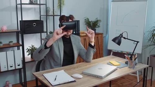 Businessman Working Using Virtual Reality Futuristic Technology VR App Headset Helmet at Home Office