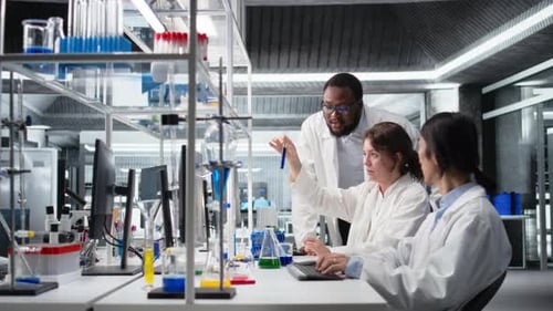 Scientists Working Together in Modern Lab