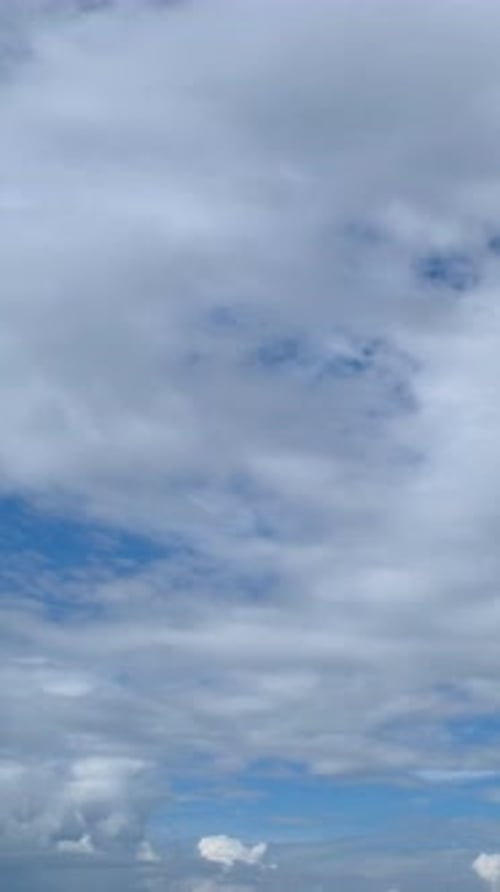 Blue sky with fluffy cloud time lapse on a sunny day 4k footage.