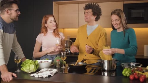 Friends Cooking Together in Modern Kitchen with Wine