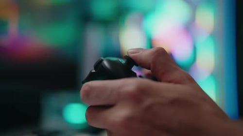 Close-up of hands using a game controller