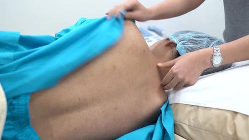 Patient Receiving Neck Massage in Hospital Setting