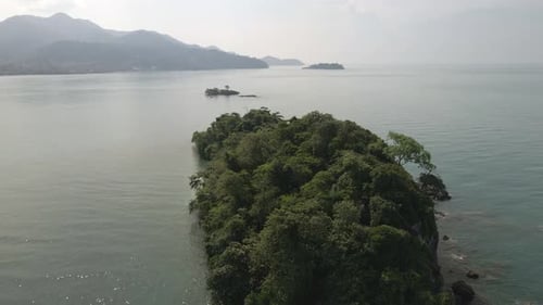 slow aerial orbit shot a small deserted tropical island in Thailand Koh Chang