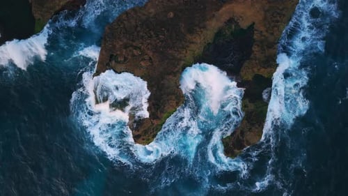 Waves Crashing on the Rocky Shore Drone View From Above