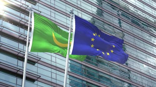 Mauritania and European Union Flags Waving with Modern Building Background