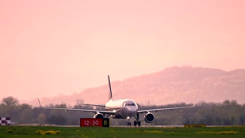 Huge Airplane Jet Maneuvering After Landing at International Airport Landing Zone at Beautiful