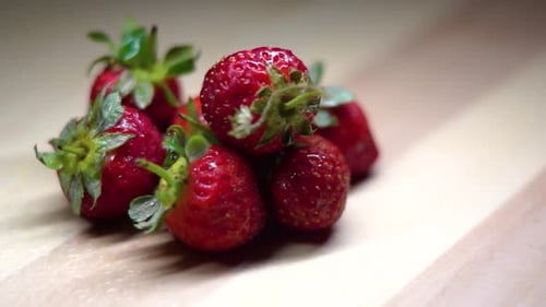 close up of some red berries with a rotating shot