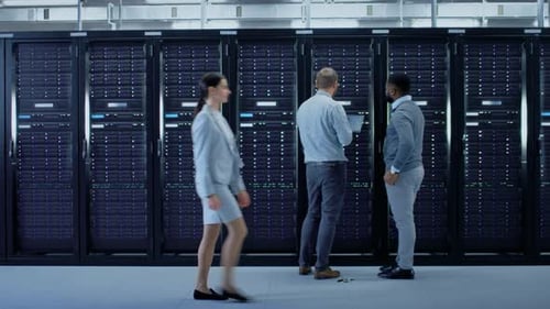 Technicians Work In Data Center Server Room
