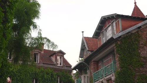 Beautiful flowery house in the famous street of Montsouris, Paris. Picturesque façade of traditional