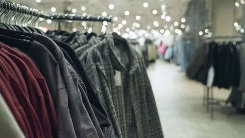 FirstPerson View of Clothing Store with Various Clothes and Blurred Background