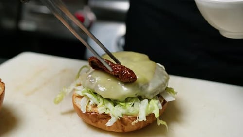 Preparing a Delicious Cheeseburger with Sundried Tomatoes