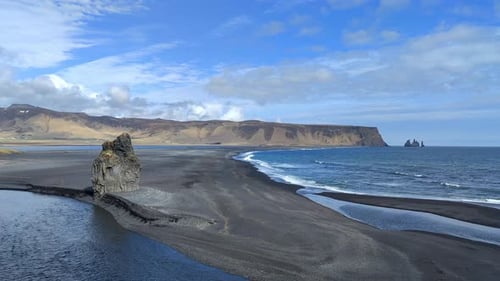 Beautiful Landscape Of Iceland With Black Seashore And Clouds