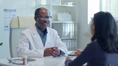 Doctor Consults with Patient in Bright Office