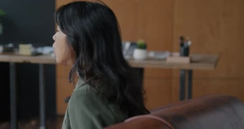 Troubled Young Woman Talking to Therapist During Individual Consultation in Psychologist Office