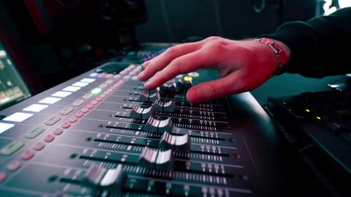 Close Up the Recording Room Dark with Neon Lighting in the Studio the Sound Engineer Works with the